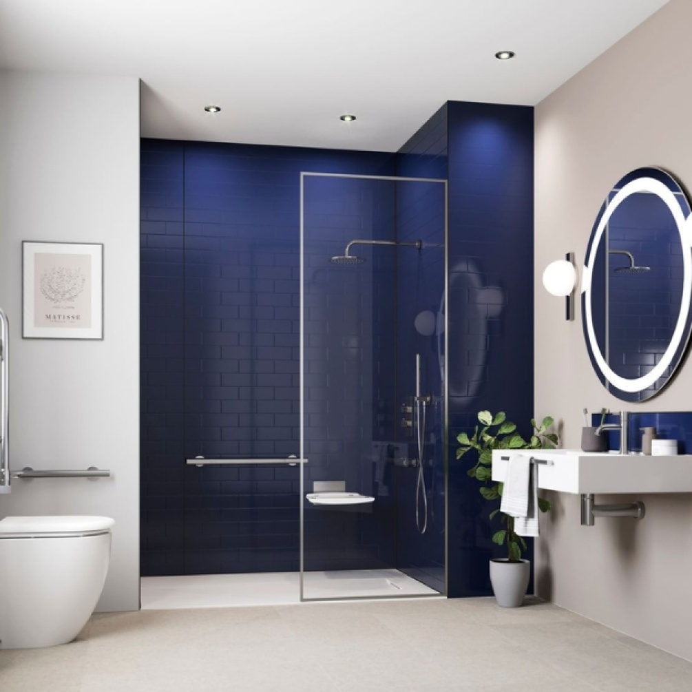 Lifestyle image of the Showerwall Compact Midnight Blue 2440mm x 1220mm Tile Effect Wall Panel - SWCT03 installed in a walk-in shower enclosure with grab bar and concealed shower with overhead & handset.